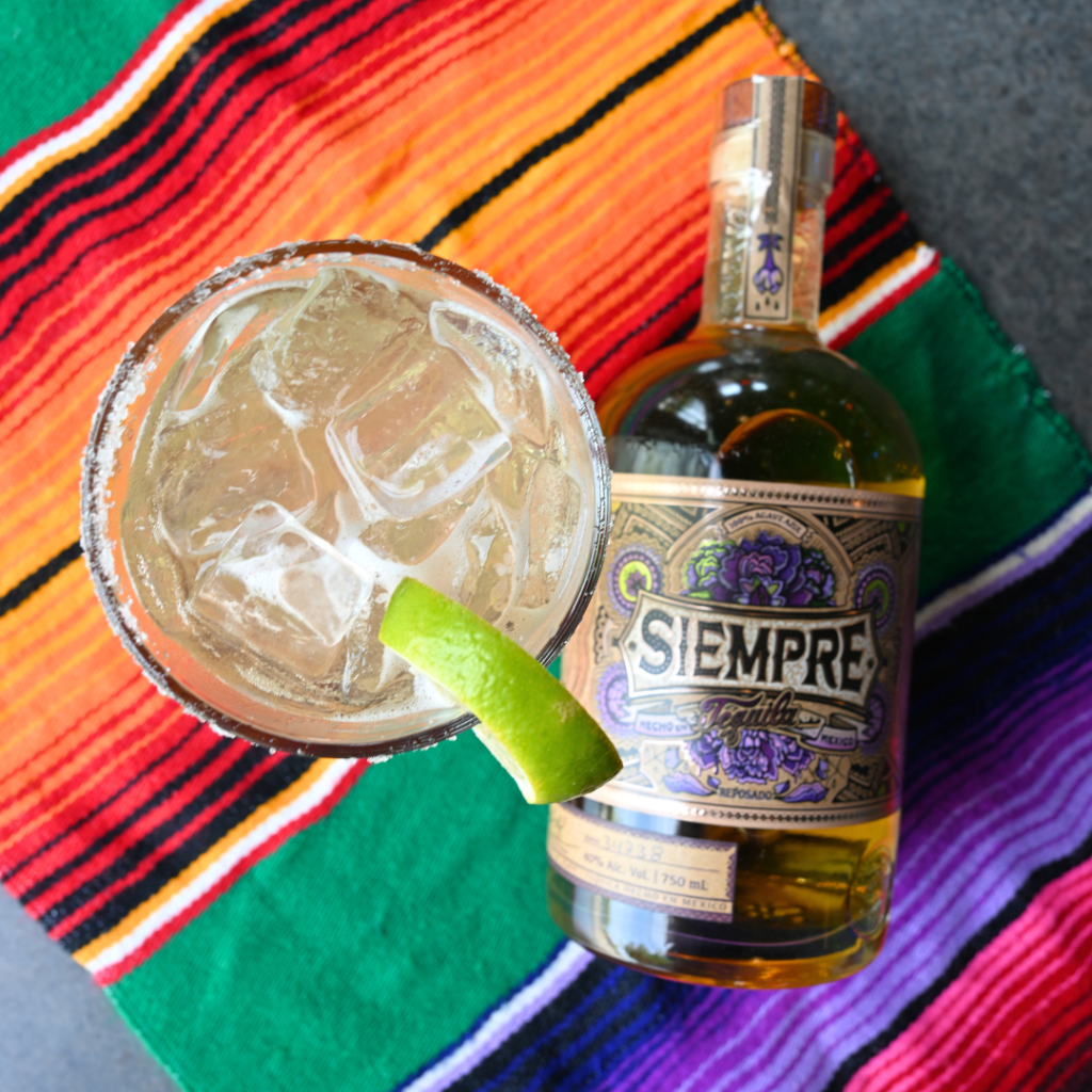 18oz Margarita On The Rocks With Siempre Reposado Tequila, Triple Sec, And Julios Secret Mix.